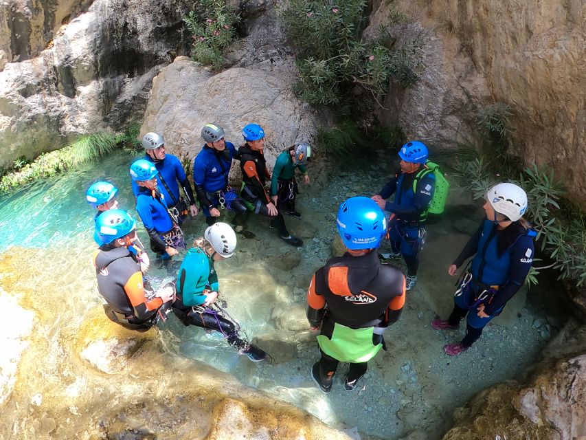 From Granada: Rio Verde Canyoning Tour with Lunch - Slides, jumps, and clear mountain pools