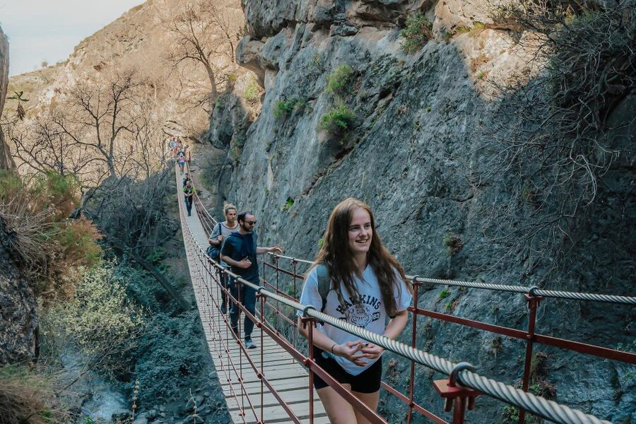 Granada: Los Cahorros Guided Afternoon Hiking Tour - Waterfalls and cold water below the rocks